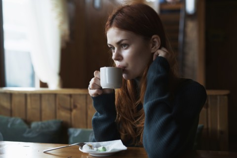 Woman drinking coffee in cafe