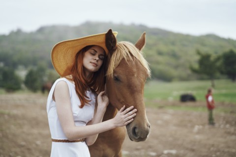 Woman petting horse