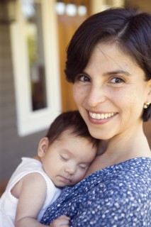 Portrait of mother with sleeping baby