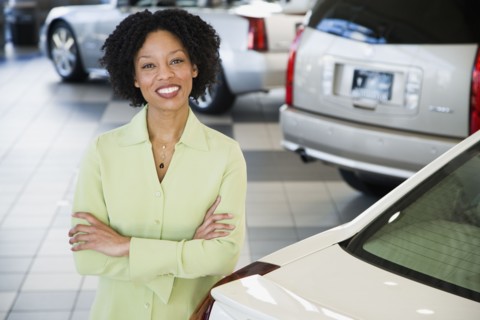 Car saleswoman smiling