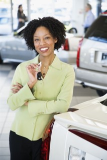 Car saleswoman smiling