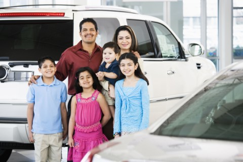 Hispanic family at car dealership