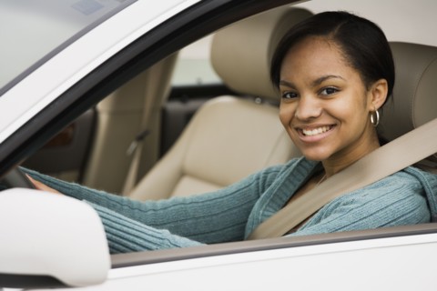 African woman sitting in car