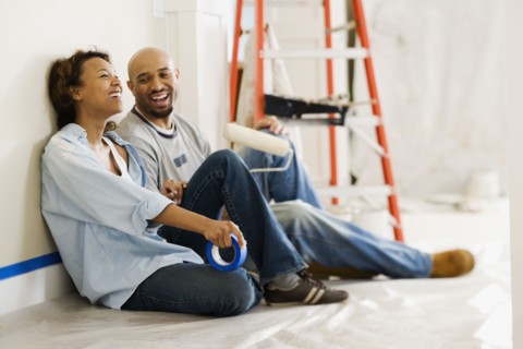 African couple taking break from painting