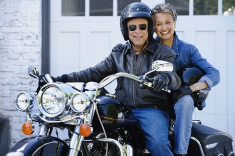Senior African American couple on motorcycle
