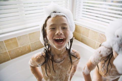 Asian sisters in bubble bath