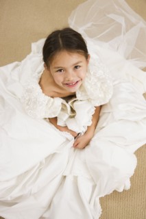 Asian girl trying on wedding dress