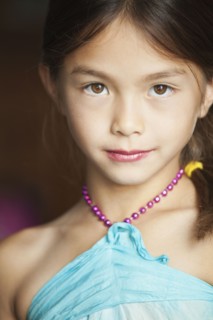 Mixed race girl wearing lipstick