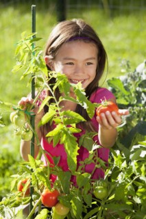 Mixed race girl gardening