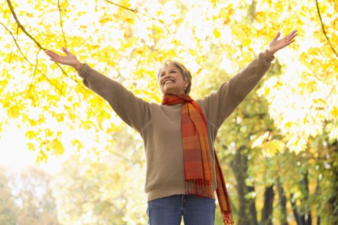 Mixed race woman standing in park