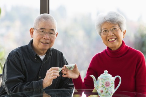 Chinese couple having tea together