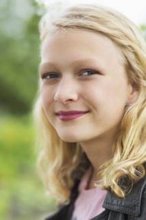 Caucasian girl smiling outdoors
