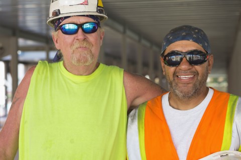 Workers smiling at construction site