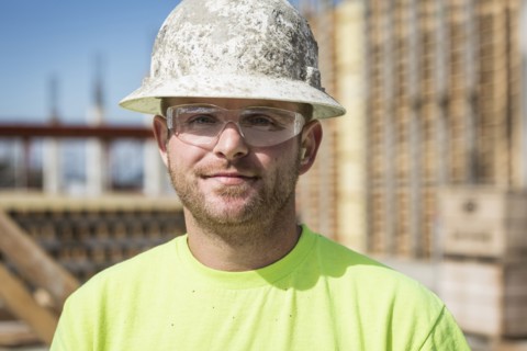 Worker smiling on construction site