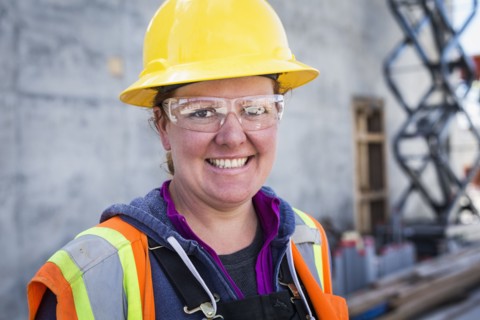Caucasian worker wearing safety goggles on site