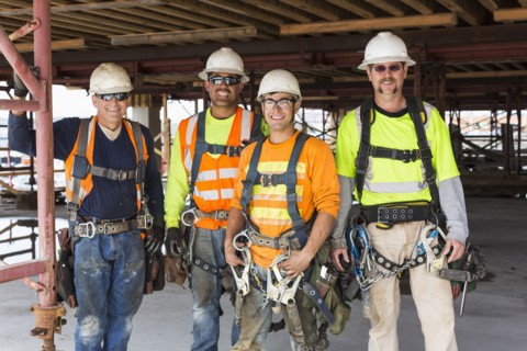 Workers smiling at construction site