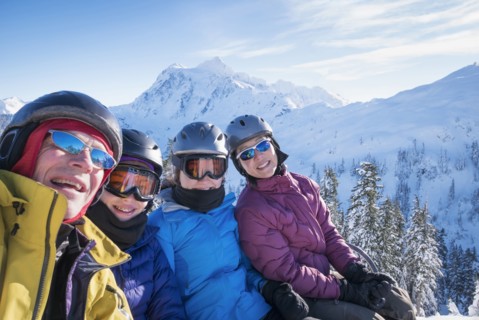 Family riding ski lift