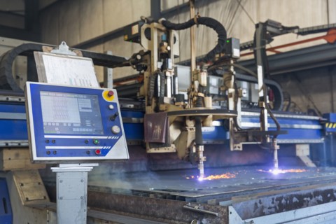 Control panel and machinery fabricating metal in factory