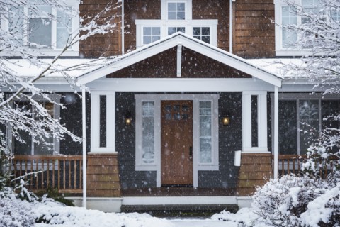 Snow falling near house