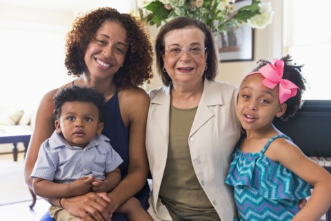 Portrait of smiling mixed race multi-generation family