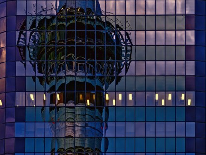 Skytower reflected in skyscraper windows