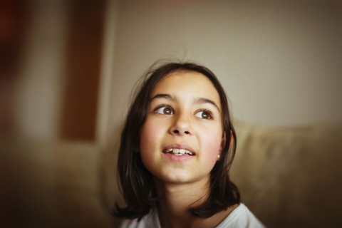 Mixed race girl looking up