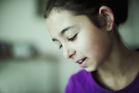 Mixed race girl looking down