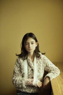 Mixed race girl wearing sling on arm