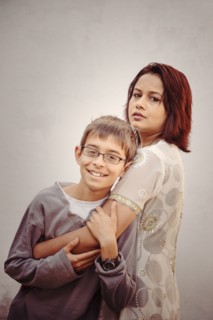 Mother and son hugging outdoors