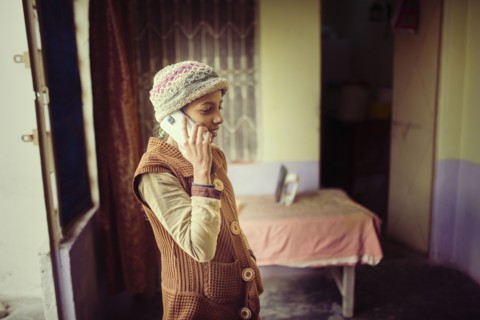 Woman in knit hat talking on cell phone