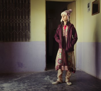 Mixed race girl wearing traditional clothing