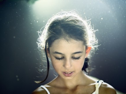 Close up of mixed race girl looking down