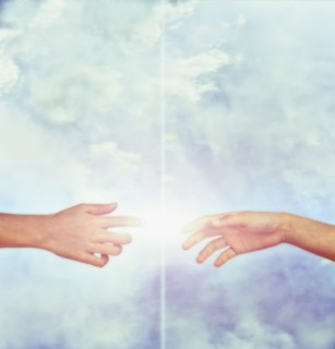 Bright fingers touching in sky