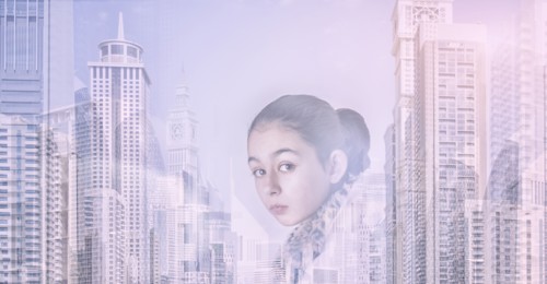 Mixed race girl over city skyline