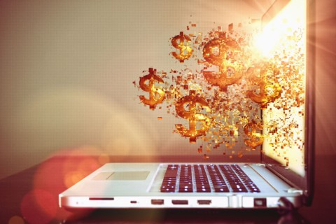 Pixelated dollar signs floating from laptop screen