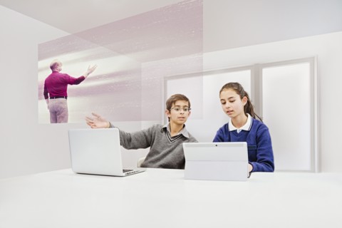 Children watching floating screen in online class