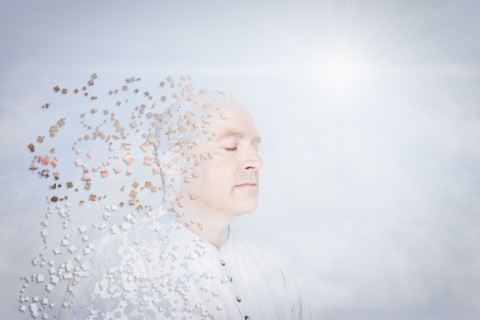 Pixelated Caucasian man in blue sky
