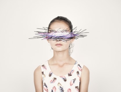 Mixed race girl with eyes scribbled out