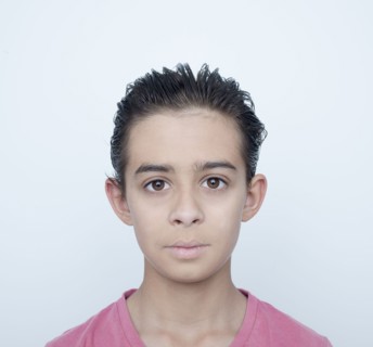 Close up of serious mixed race boy