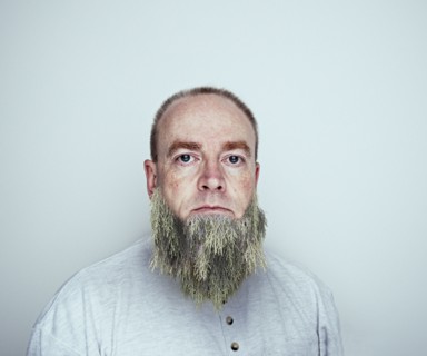 Caucasian man wearing tree beard