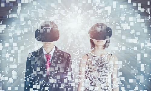 Mixed Race brother and sister using vr goggles