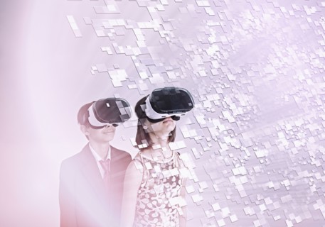 Mixed Race brother and sister using vr goggles