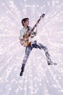 Mixed Race boy playing virtual guitar