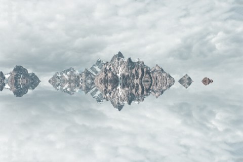 Mirror image of mountains and clouds