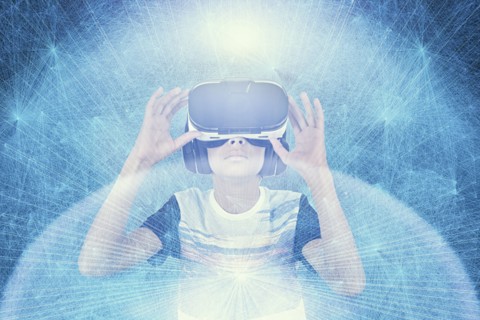 Mixed Race boy wearing VR goggles in cyberspace