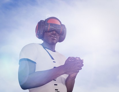 Strong man wearing virtual reality helmet