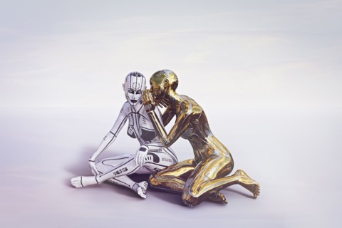 Gold female cyborg sitting and whispering to white cyborg