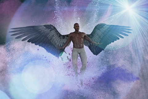 Man with angel wings flying in purple sky