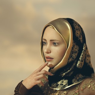 Pensive woman wearing ornate hijab