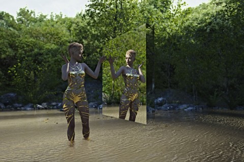 Reflection of woman in virtual mirror standing in river
